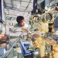 Physicist checking experimental equipment at Stanford Synchrotron Radiation Lightsource (SSRL).